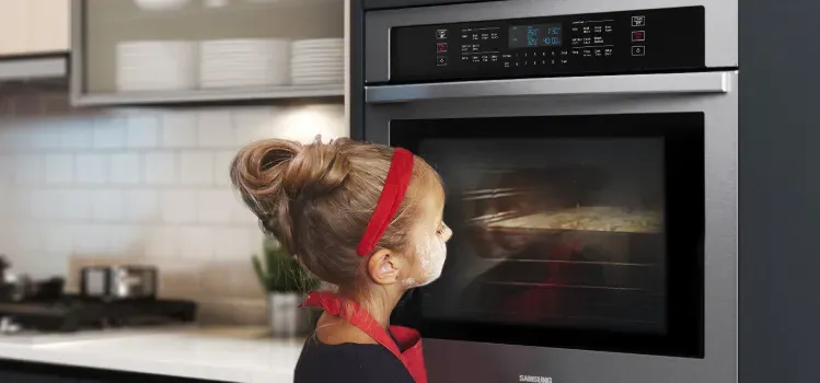 samsung-NV51T5511DS-conventional-wall-oven-girl-watching-food-bake